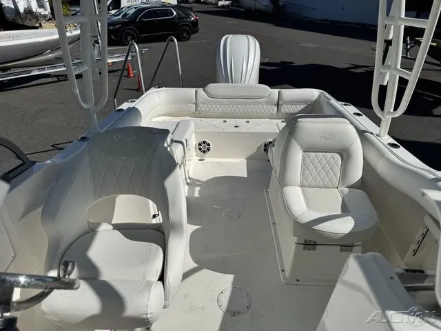 Slide: The Image of 2025 Key West 239 DFS boat interior with white seating and spacious layout. - 24
