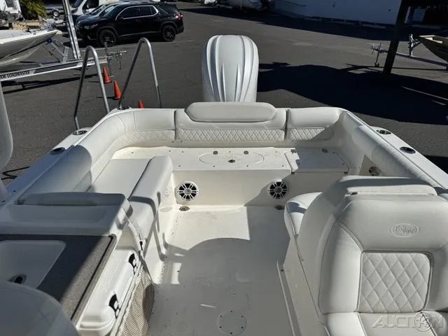 Slide: The Image of 2025 Key West 239 DFS boat interior with white seating and speakers. - 25