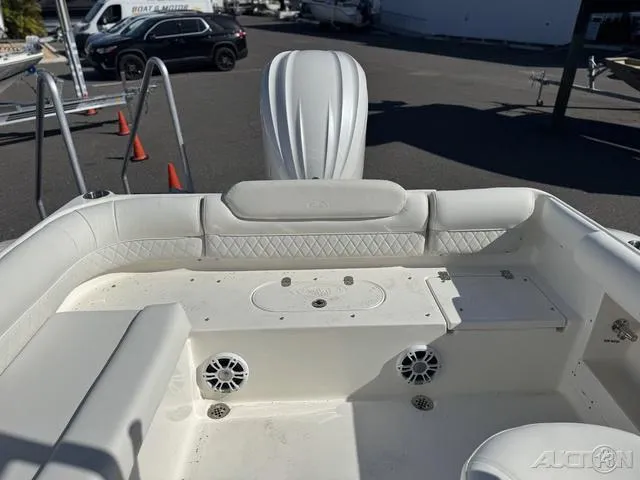 Slide: The Image of 2025 Key West 239 DFS boat interior with storage compartment and cooler. - 26