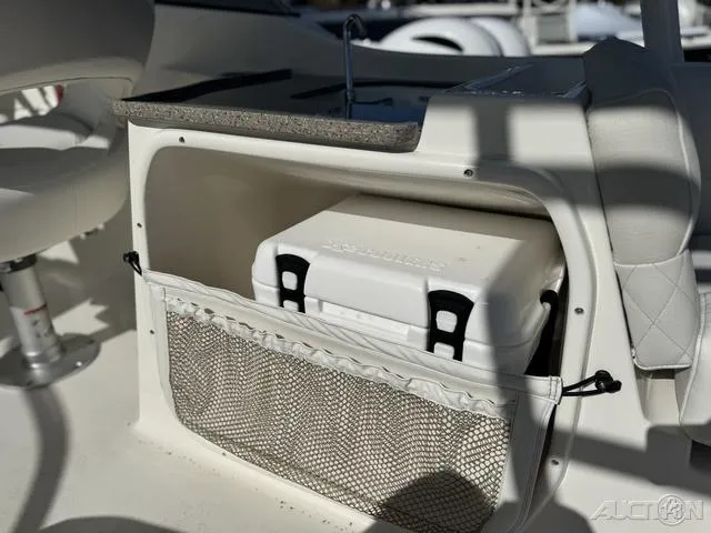 Slide: The Image of 2025 Key West 239 DFS boat interior with storage compartment and cooler. - 27