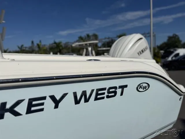 Slide: The Image of 2025 Key West 239 DFS boat with Yamaha engine, parked outdoors. - 4