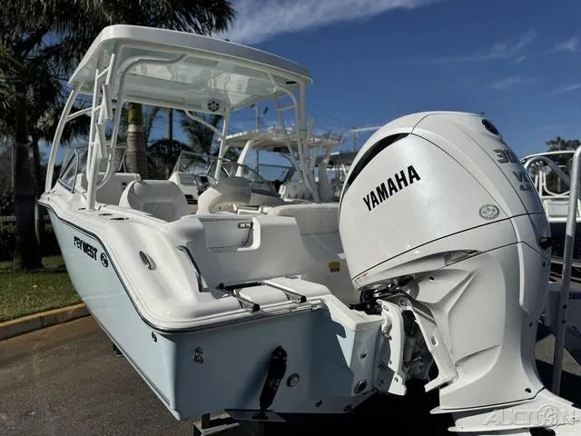 Slide: The Image of 2025 Key West 239 DFS boat with 300 V6 engine, parked outdoors. - 5