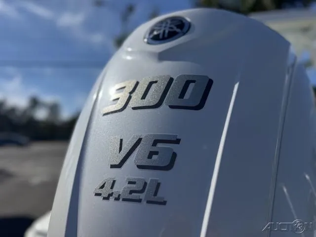 Slide: The Image of 2025 Key West 239 DFS boat displayed at a dealership under a clear sky. - 7