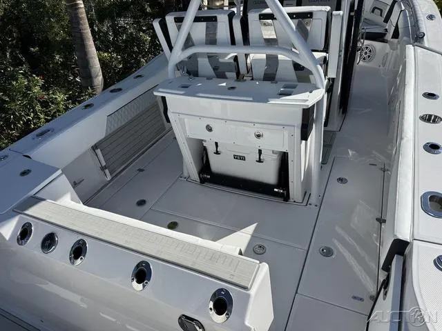 Slide: The Image of 2025 Blackfin 272CC boat deck with seating and storage compartments. - 10