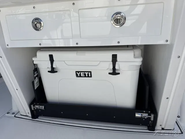 Slide: The Image of 2025 Blackfin 272CC boat storage with Yeti cooler and drawers. - 13