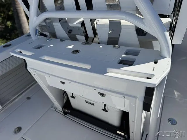 Slide: The Image of 2025 Blackfin 272CC boat console with storage and seating. - 14
