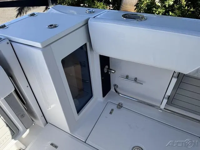 Slide: The Image of 2025 Blackfin 272CC boat interior, featuring sleek white design and modern fixtures. - 20