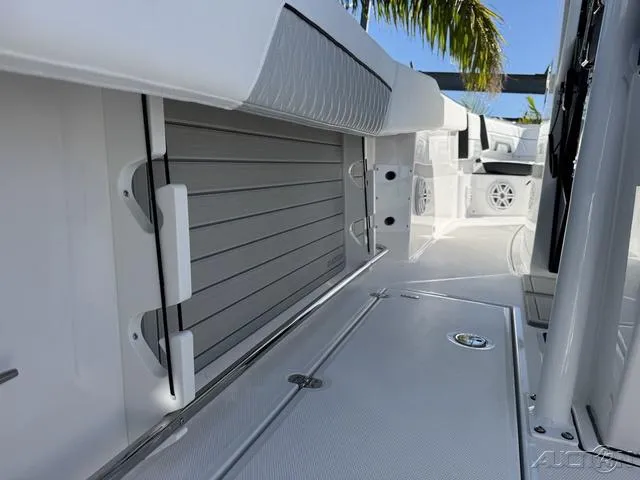 Slide: The Image of 2025 Blackfin 272CC boat interior with sleek, modern design and storage compartments. - 21