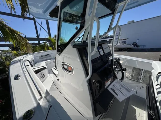 Slide: The Image of 2025 Blackfin 272CC boat interior with modern console and seating. - 26