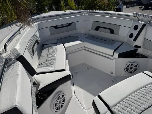 Slide: The Image of Luxurious seating area on 2025 Blackfin 272CC boat with modern design and speakers. - 29