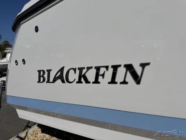 Slide: The Image of 2025 Blackfin 272CC boat logo on white hull. - 3