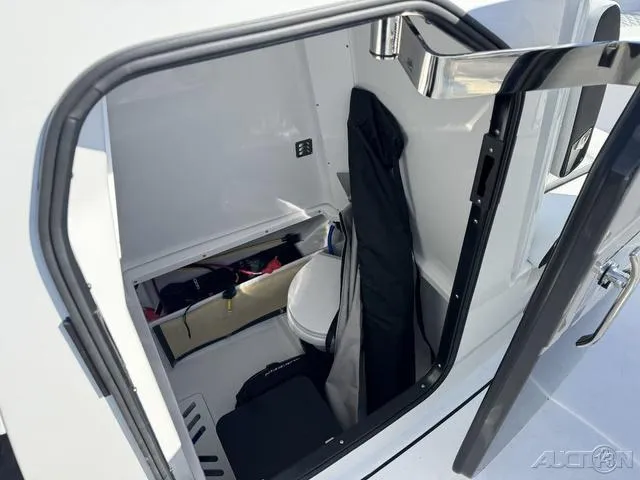 Slide: The Image of 2025 Blackfin 272CC boat interior with storage and toilet. - 40
