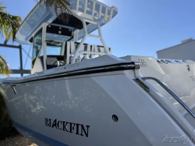 Slide: The Image of 2025 Blackfin 272CC boat, sleek design, sunny day, close-up view. - 7