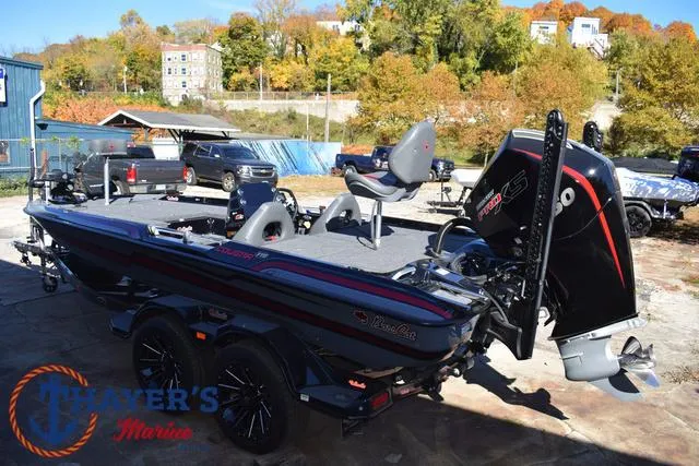 Slide: The Image of 2025 Bass Cat Cougar FTD boat in marina, featuring sleek design and powerful engine. - 10