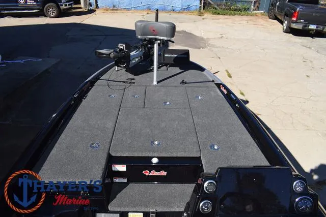 Slide: The Image of 2025 Bass Cat Cougar FTD boat deck with fishing equipment and controls. - 15