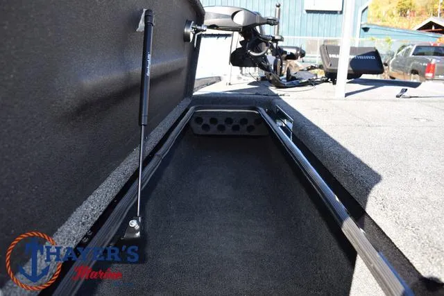 Slide: The Image of 2025 Bass Cat Cougar FTD boat storage compartment with hydraulic lift. - 17