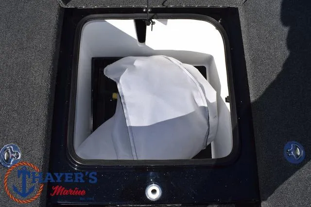 Slide: The Image of Storage compartment in 2025 Bass Cat Cougar FTD boat, featuring a covered item inside. - 20