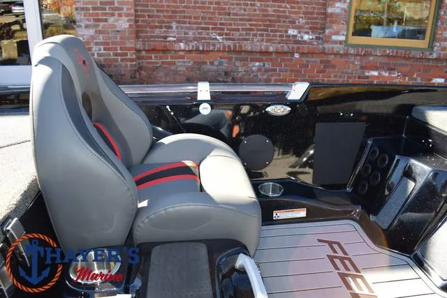 Slide: The Image of 2025 Bass Cat Cougar FTD boat interior with gray and red seating. - 25