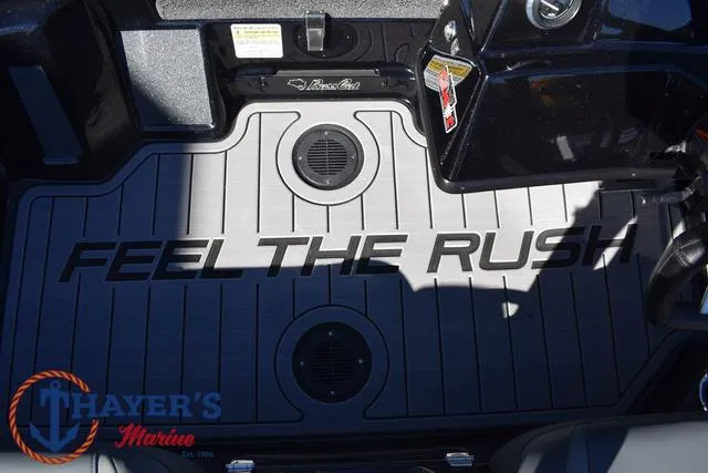 Slide: The Image of 2025 Bass Cat Cougar FTD boat interior with "Feel the Rush" text on floor. - 29
