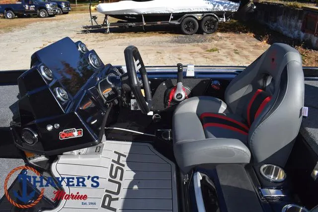 Slide: The Image of 2025 Bass Cat Cougar FTD boat interior with steering console and seating. - 31