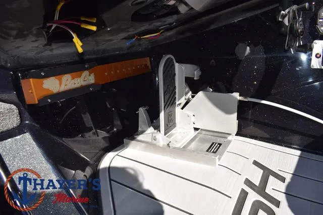 Slide: The Image of 2025 Bass Cat Cougar FTD boat interior with Thayer's Marine branding. - 33