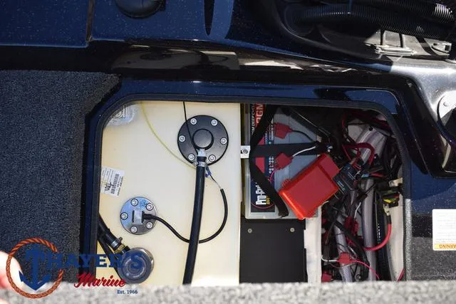 Slide: The Image of 2025 Bass Cat Cougar FTD boat battery compartment with wiring and components. - 42