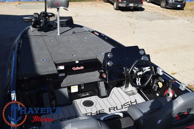 Slide: The Image of 2025 Bass Cat Cougar FTD boat interior with steering wheel and seating. - 45