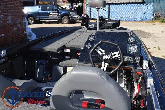 Slide: The Image of 2025 Bass Cat Cougar FTD boat interior with steering wheel and dashboard controls. - 47