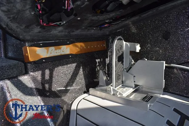 Slide: The Image of Bass Cat Cougar FTD 2025 boat interior with Thayer's Marine branding. - 11