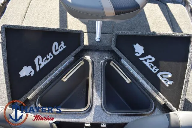 Slide: The Image of 2025 Bass Cat Cougar FTD boat storage compartments, open with logo, at Thayer's Marine. - 16