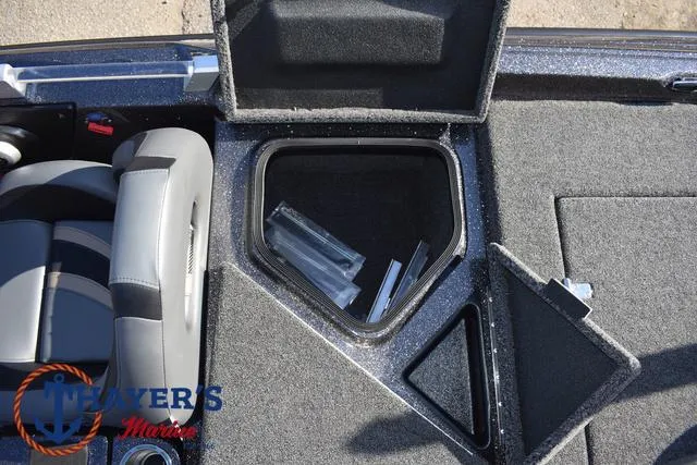 Slide: The Image of 2025 Bass Cat Cougar FTD boat interior with open storage compartments. - 17