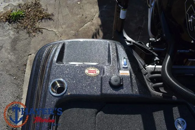 Slide: The Image of 2025 Bass Cat Cougar FTD boat deck with control panel and logo. - 23