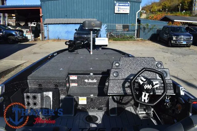 Slide: The Image of 2025 Bass Cat Cougar FTD boat interior with steering wheel and control panel. - 25