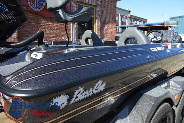 Slide: The Image of 2025 Bass Cat Cougar FTD boat with sleek design, showcased at Thayer's Marine. - 29