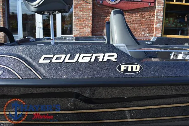 Slide: The Image of 2025 Bass Cat Cougar FTD boat with sleek design, displayed at Trayer's Marine. - 37