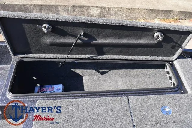 Slide: The Image of Open storage compartment in 2025 Bass Cat Cougar FTD boat at Thayer's Marine. - 49