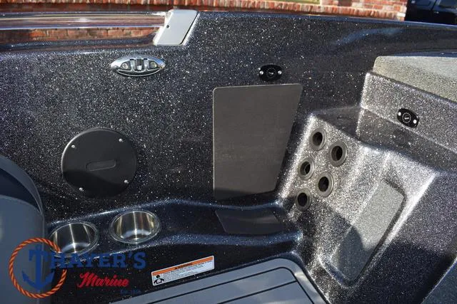 Slide: The Image of 2025 Bass Cat Cougar FTD boat interior with cup holders and control panel. - 5