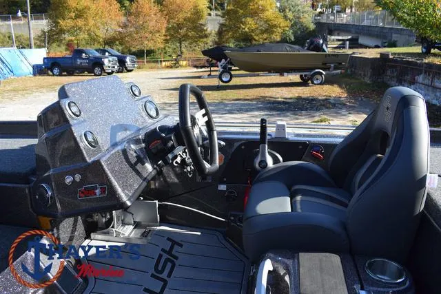 Slide: The Image of 2025 Bass Cat Cougar FTD boat interior with steering wheel and seats. - 9