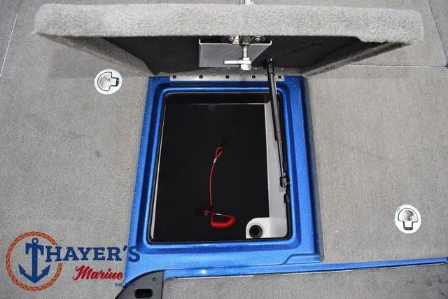Slide: The Image of Open storage compartment on 2018 Nitro Z21 boat with Thayer's Marine logo. - 16