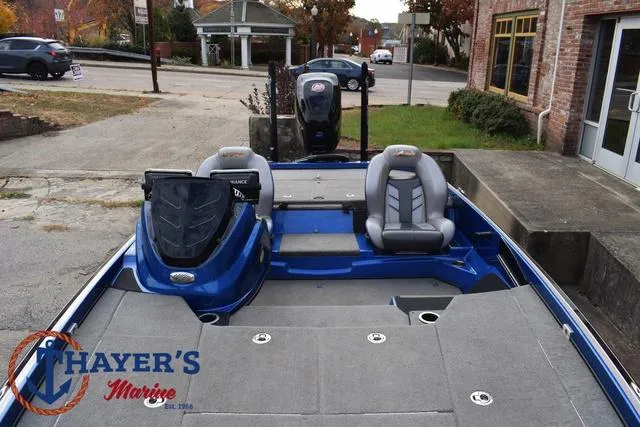 Slide: The Image of 2018 Nitro Z21 boat with dual seats, blue exterior, and Thayer's Marine branding. - 20