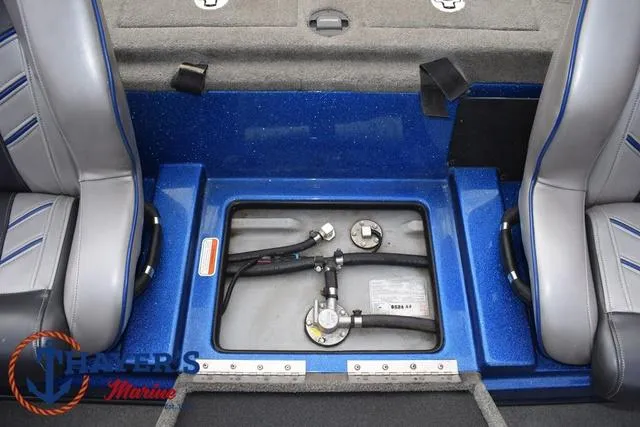 Slide: The Image of 2018 Nitro Z21 boat interior showing fuel tank compartment between seats. - 24