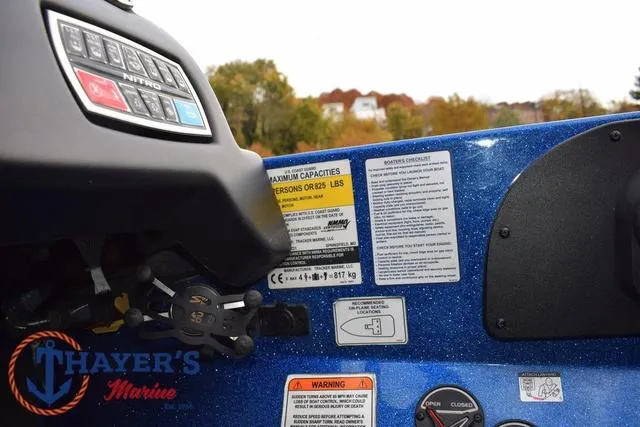 Slide: The Image of Control panel of 2018 Nitro Z21 boat with safety labels and Thayer's Marine logo. - 29
