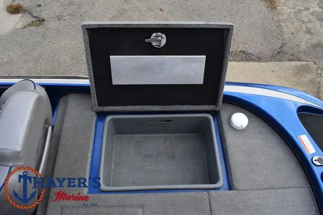 Slide: The Image of Open storage compartment on 2018 Nitro Z21 boat deck. - 31
