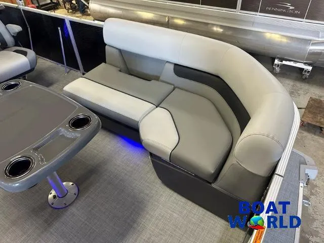Slide: The Image of 2025 Princecraft Vectra 21 RL SS pontoon interior with gray seating and table, Boat World logo. - 10