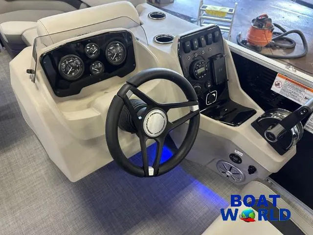 Slide: The Image of 2025 Princecraft Vectra 21 RL SS pontoon boat dashboard with steering wheel and controls. - 14