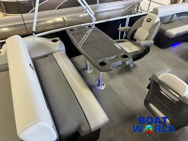 Slide: The Image of 2025 Princecraft Vectra 21 RL SS pontoon interior with seating and table, showcased by Boat World. - 19