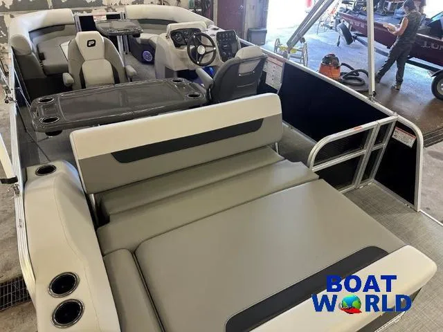 Slide: The Image of 2025 Princecraft Vectra 21 RL SS Swingback Pontoon interior with seating and steering console. - 21