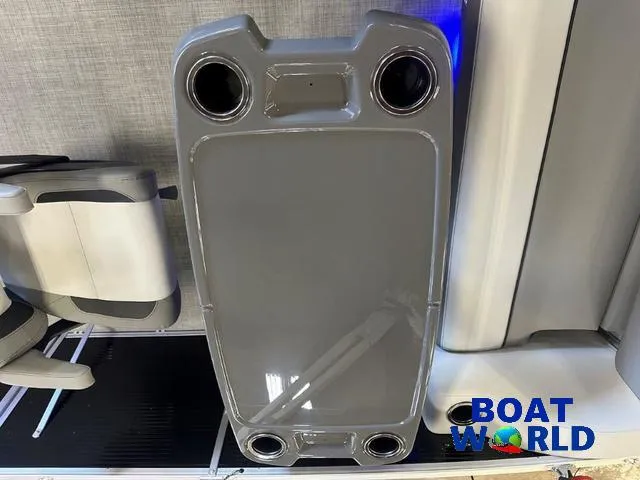 Slide: The Image of 2025 Princecraft Vectra 21 RL SS pontoon table with cup holders, Boat World logo. - 23
