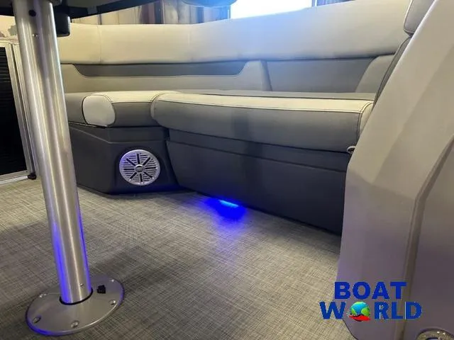 Slide: The Image of 2025 Princecraft Vectra 21 RL SS pontoon interior with cushioned seating and ambient lighting. - 25
