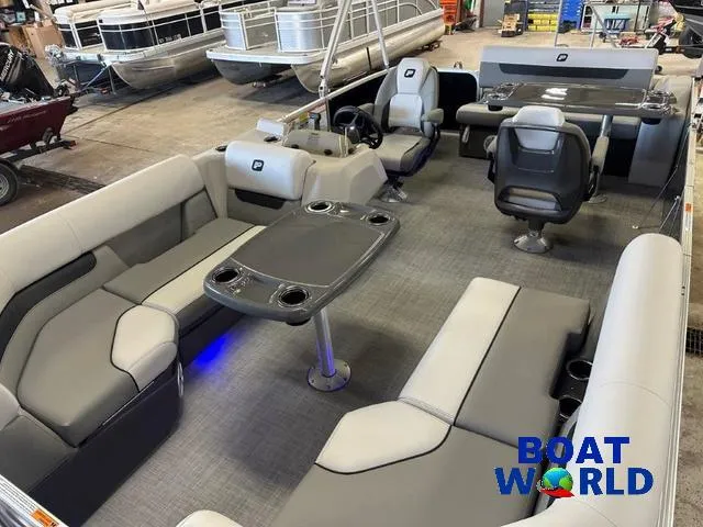 Slide: The Image of 2025 Princecraft Vectra 21 RL SS pontoon interior with seating and table, showcased at Boat World. - 27